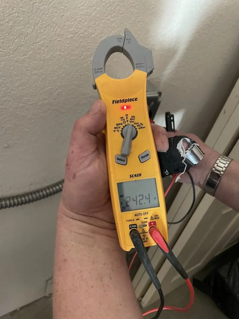 Voltage testing with clamp meter during Generator Installation in Spanish Lake